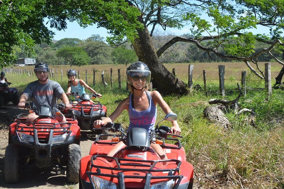 "ATV tour on Tamarindo Beach, Costa Rica, riding through sandy trails, lush jungle paths, and stunning ocean views." 🚜🌴🌊