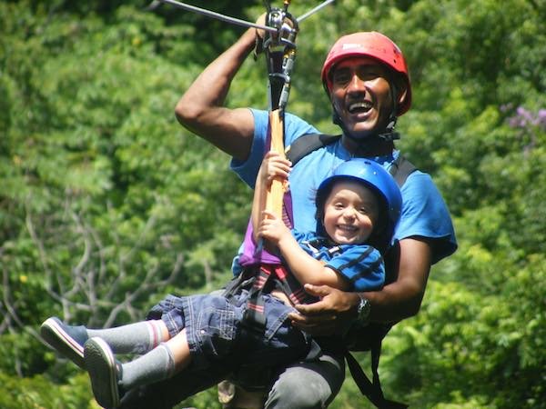 "Ziplining adventure in Tamarindo Beach, Costa Rica, soaring above lush tropical forests with stunning ocean and jungle views." 🌿🌊✨